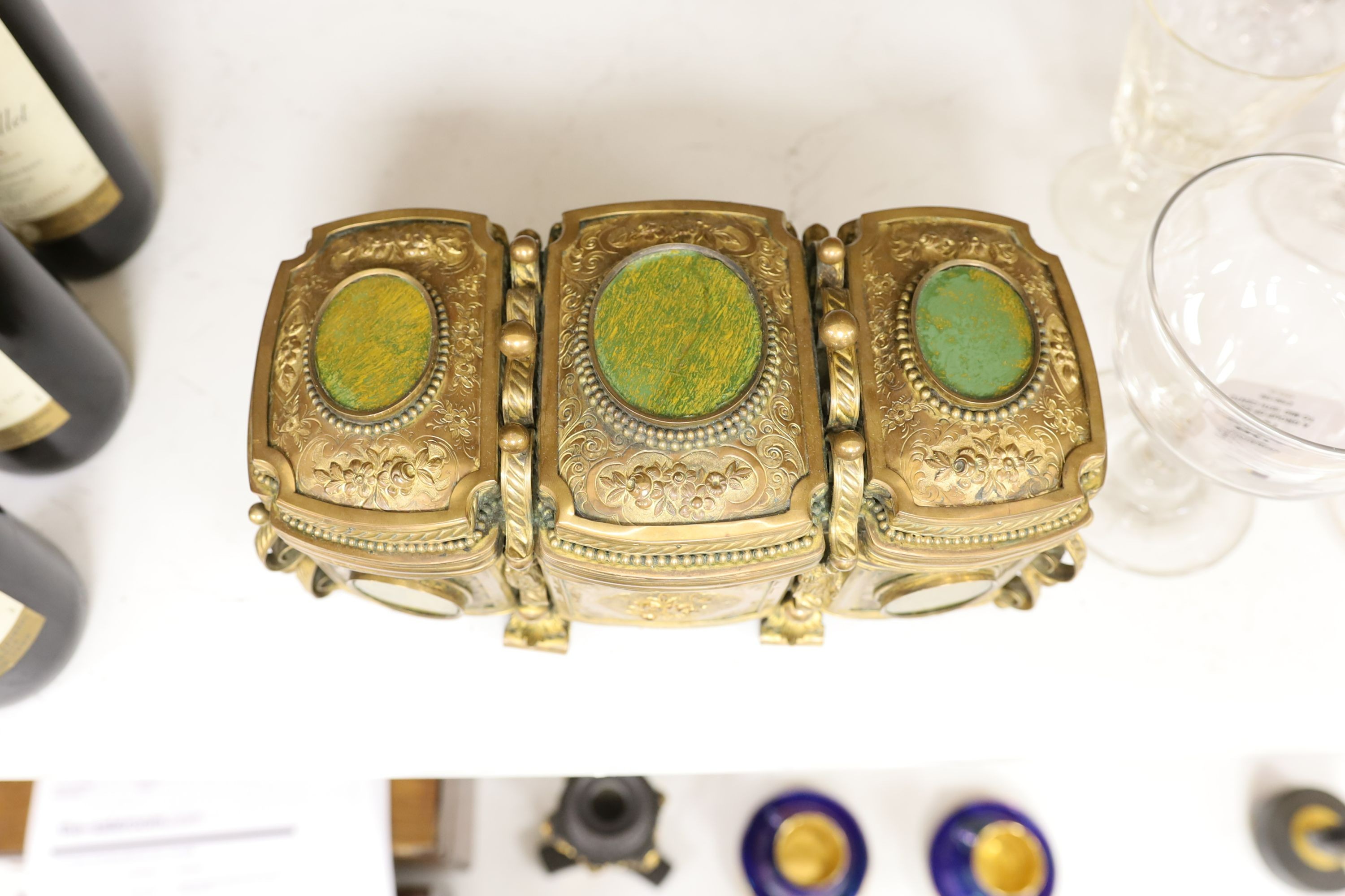 A French gilt metal casket inset with reverse painted glass panels and a pair of ormolu style candlesticks, 22.5cm tall